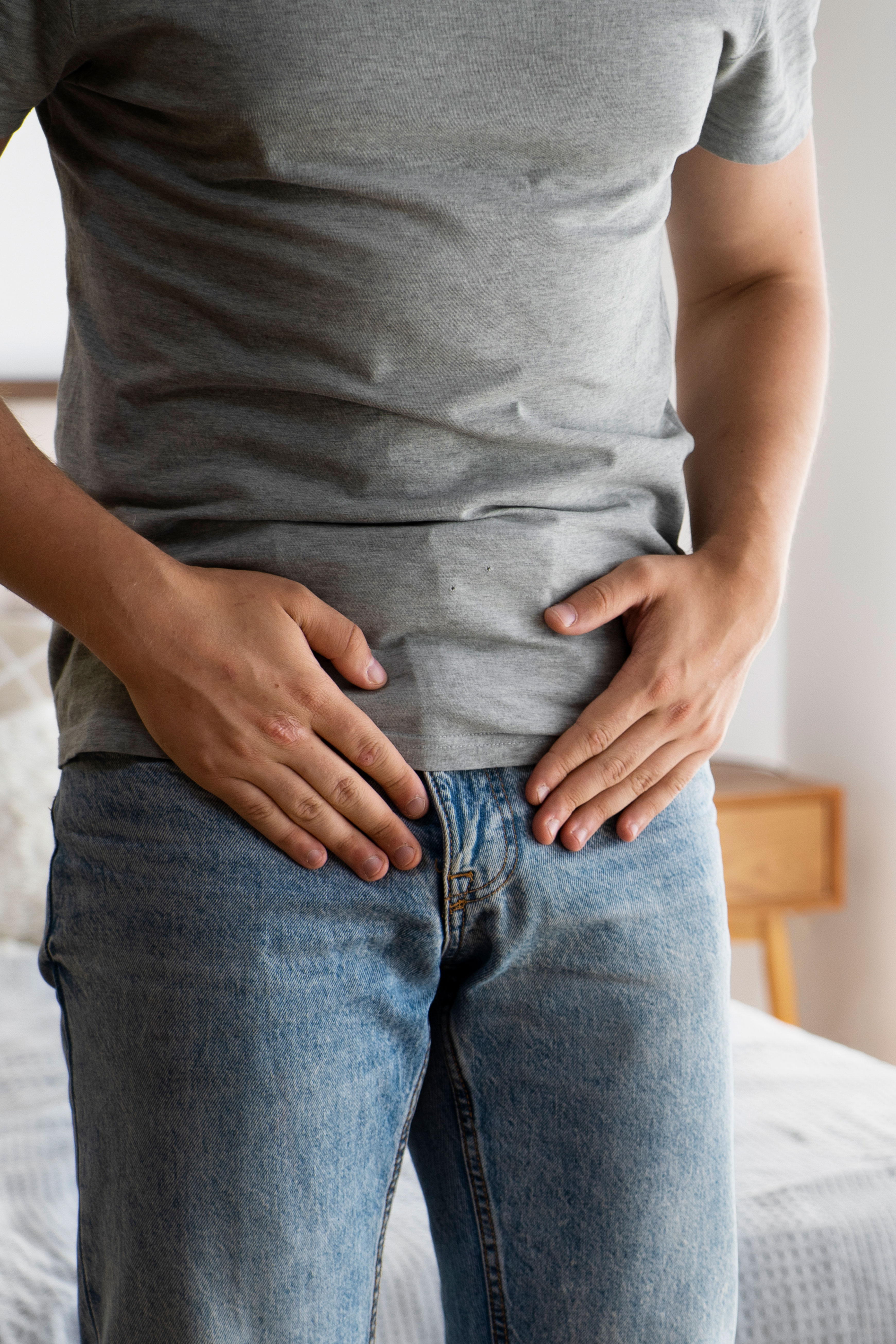 Smiling woman with a thin midsection after panniculectomy and abdominoplasty